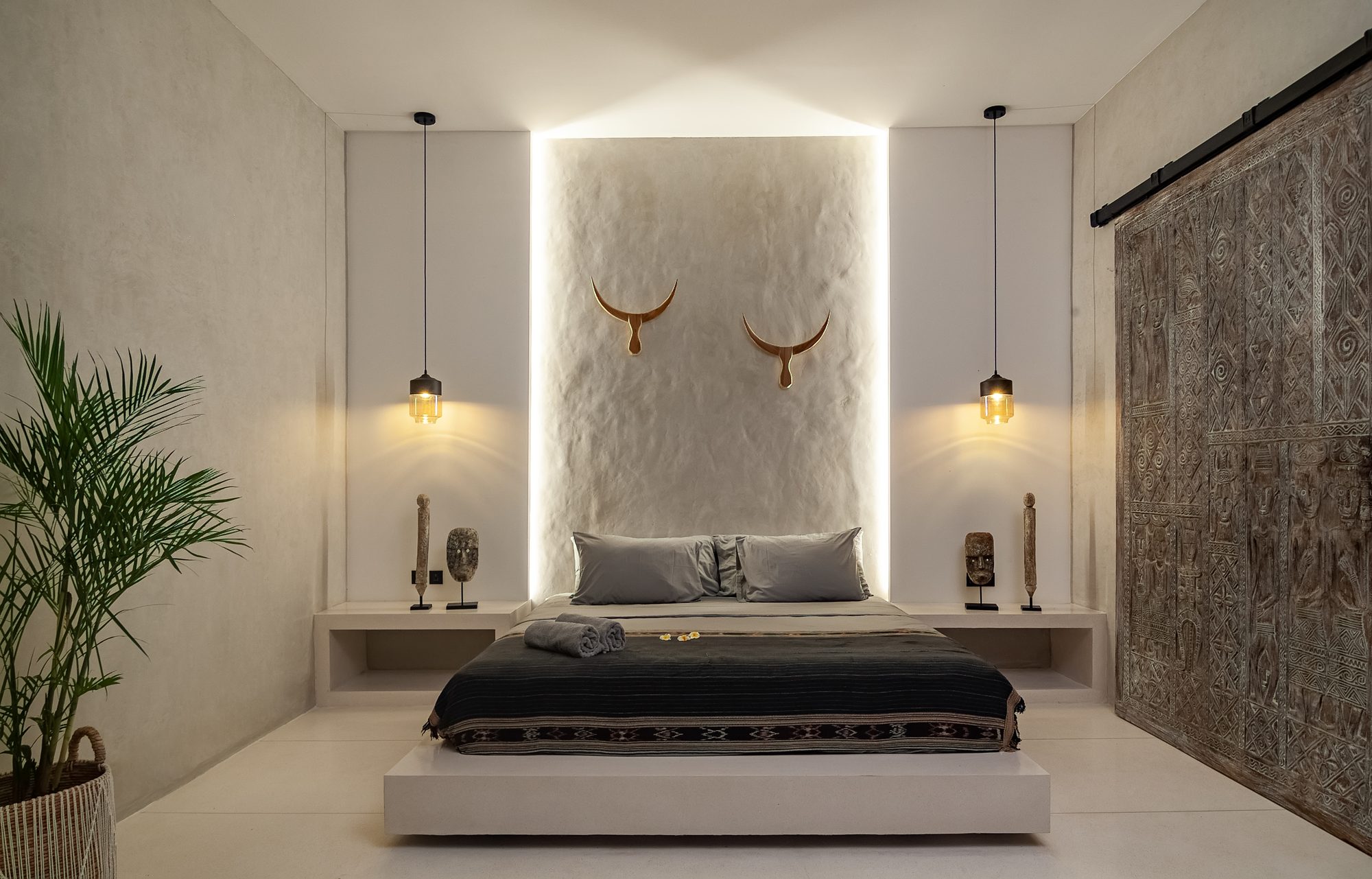 Villa Baloo master bedroom with golden bull art luxury villa Bali