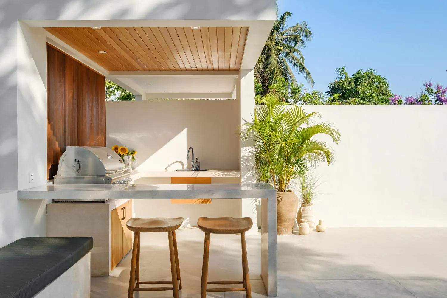 Rooftop BBQ kitchen with bar stools Villa Las Hermanas Tumbak Bayu Pererenan Bali