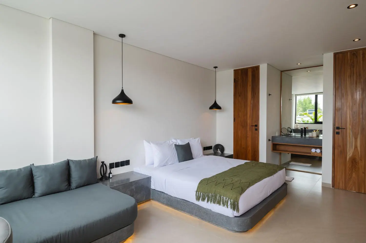 Bedroom with sofa lounge and desk Villa Julito Tumbak Bayu Pererenan Bali