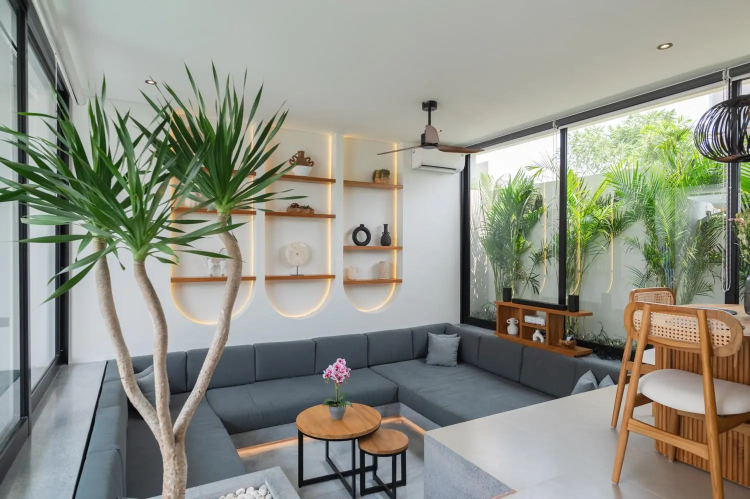 Sunken living room with backlit arched shelves Villa Julito Tumbak Bayu Pererenan Bali