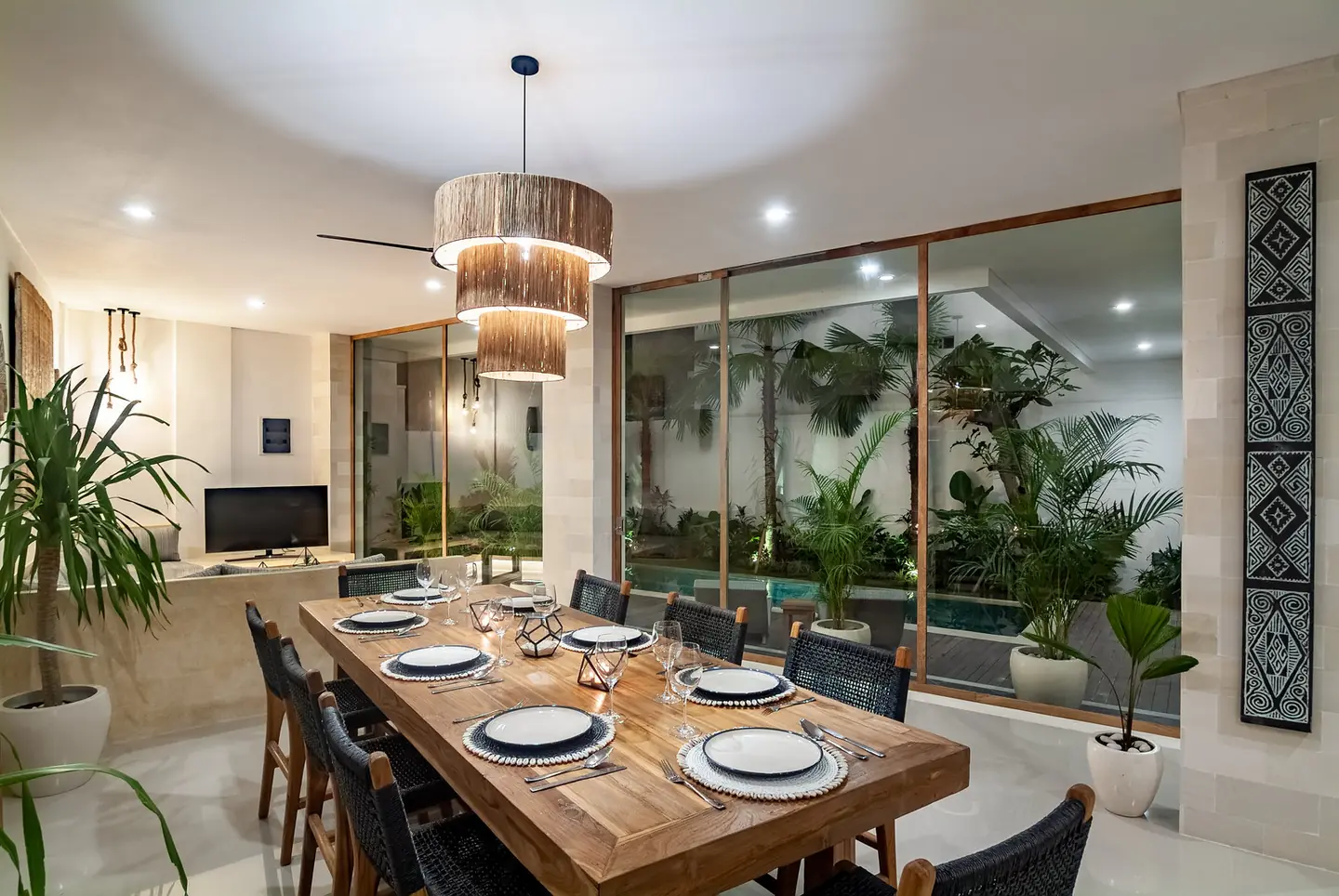 Villa Kesari dining table set for eight facing the pool Berawa Canggu Bali