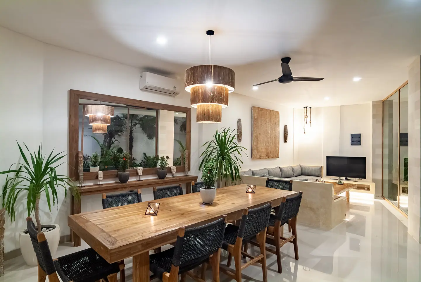 Villa Kesari dining area and sofa lounge at night Berawa Canggu Bali
