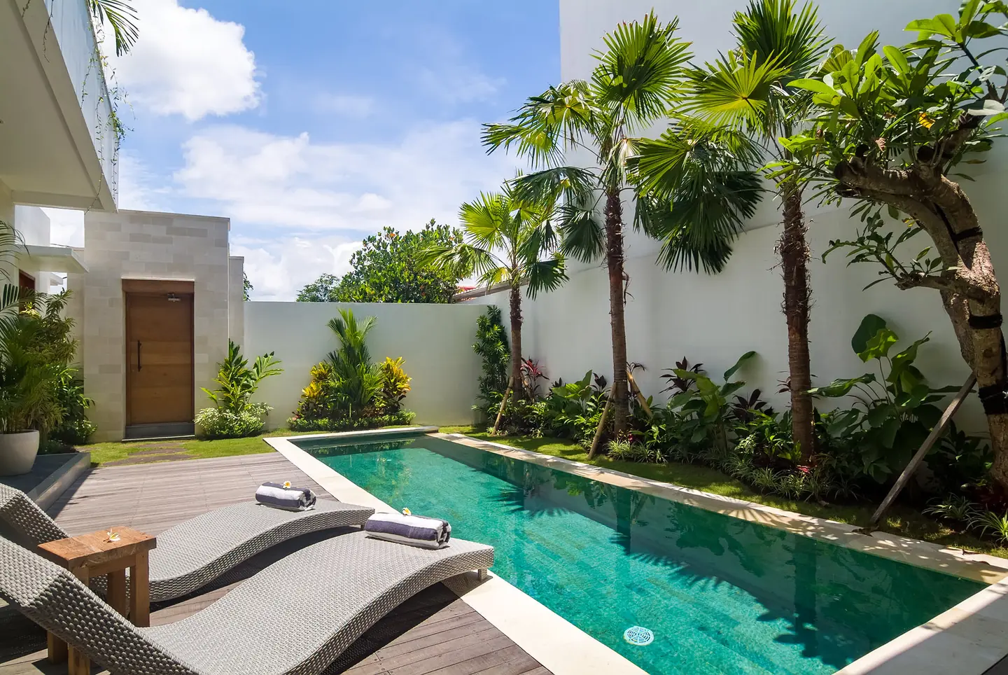 Villa Kesari private pool, sun loungers and tropical garden Berawa Canggu Bali