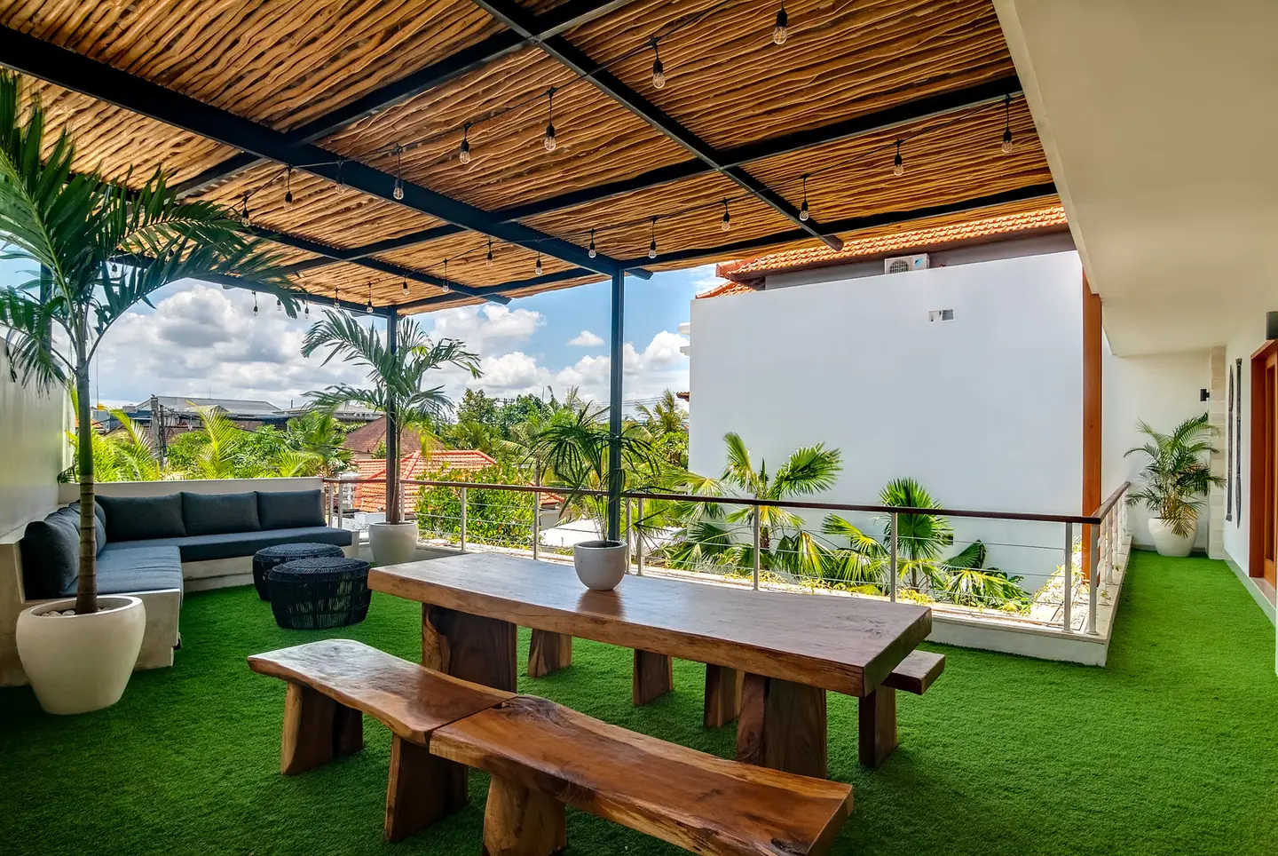 Villa Kesari covered rooftop terrace with dining table and lounge Berawa Canggu Bali