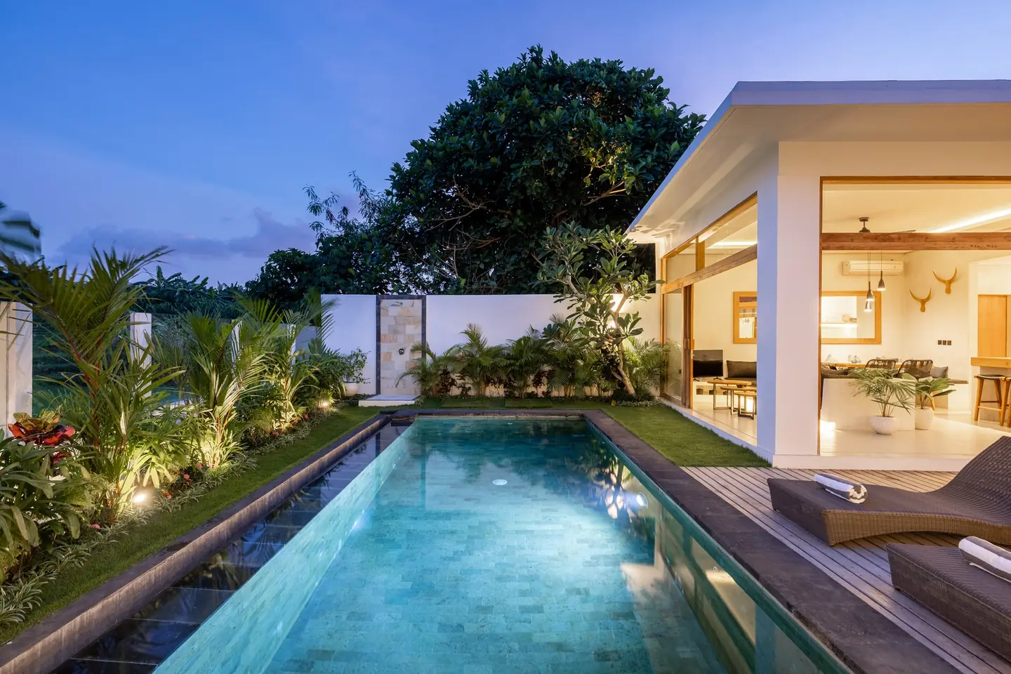 Villa Menaka private pool and tropical garden at dusk Tumbak Bayu Pererenan Bali