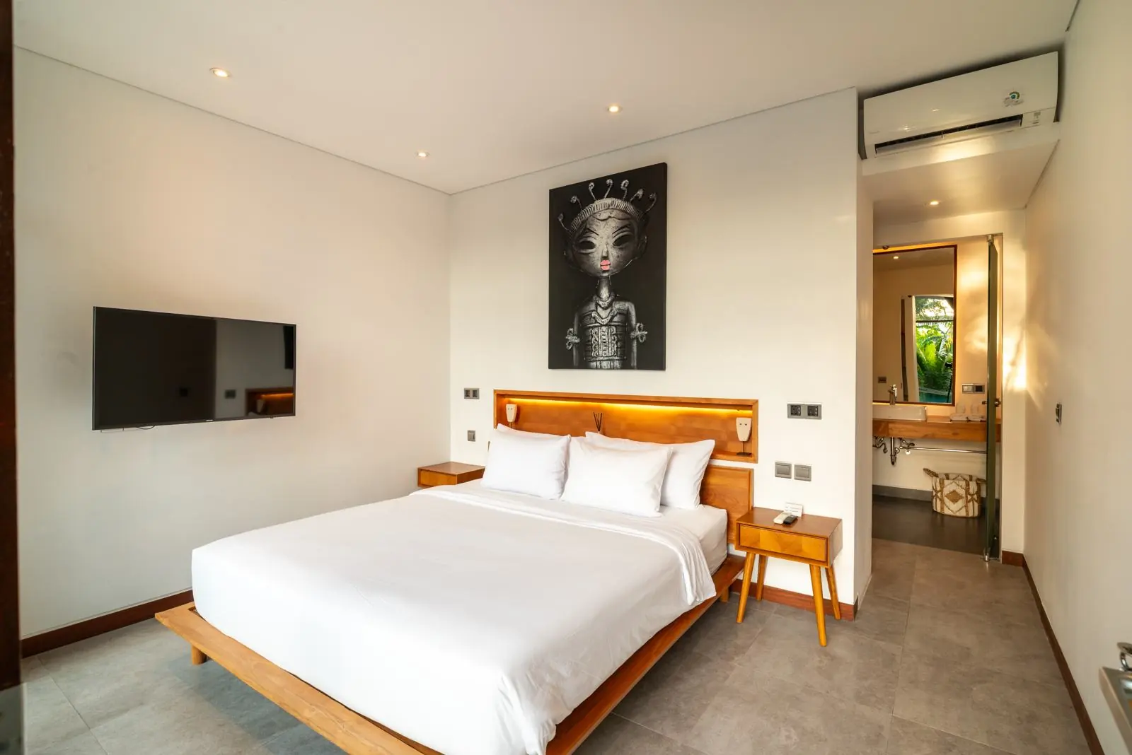 Ground-floor bedroom opening onto the pool River Paradise 5BR Pererenan Bali