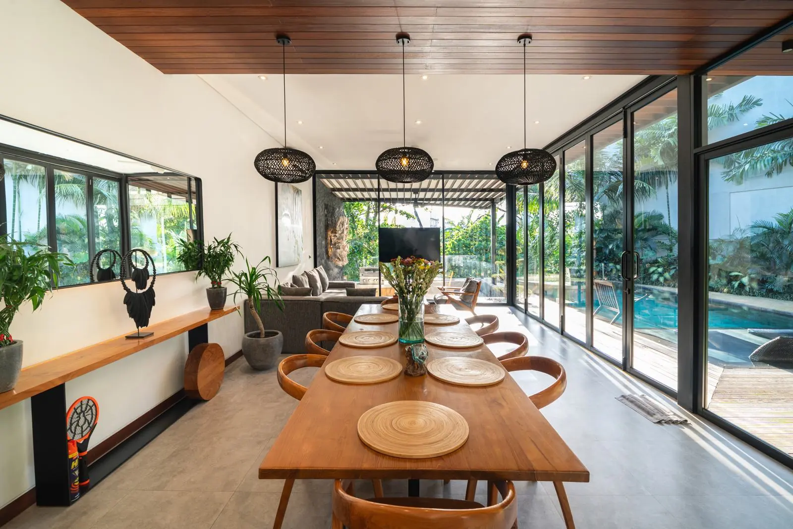 Dining table for ten opening onto the pool River Paradise 5BR Pererenan Bali