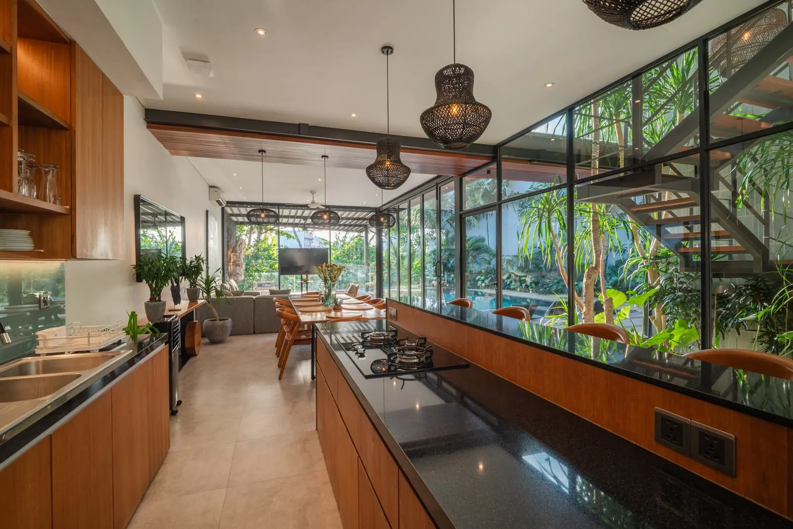 Kitchen with granite island and inner tropical garden River Paradise 5BR Pererenan Bali
