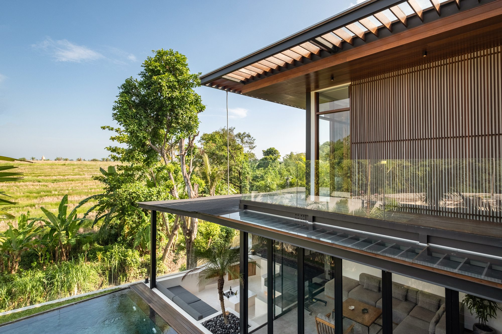 River Paradise 4BR balcony rice field views luxury villa Pererenan Bali