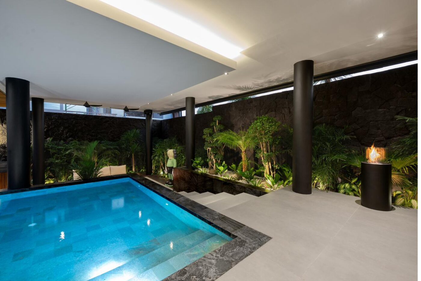Semi-covered indoor pool with wall art MAR Bali 1 luxury villa Pererenan Bali