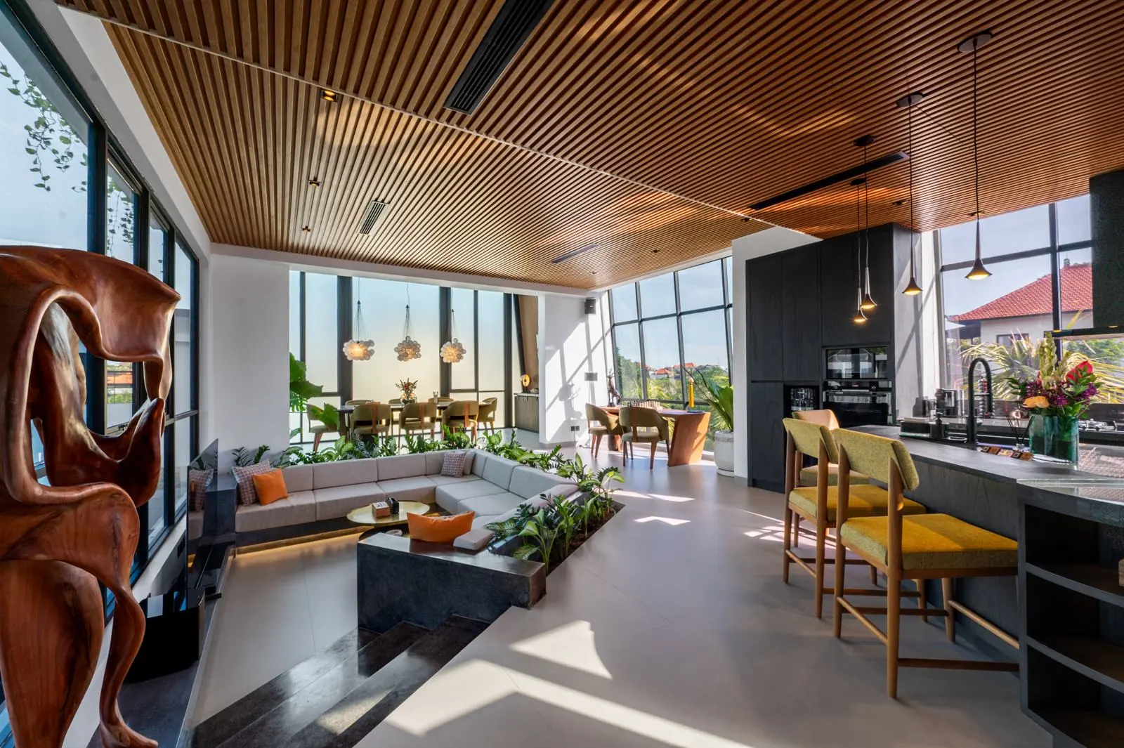 Sunken living room with integrated planting and open kitchen MAR Bali 1 luxury villa Pererenan Bali