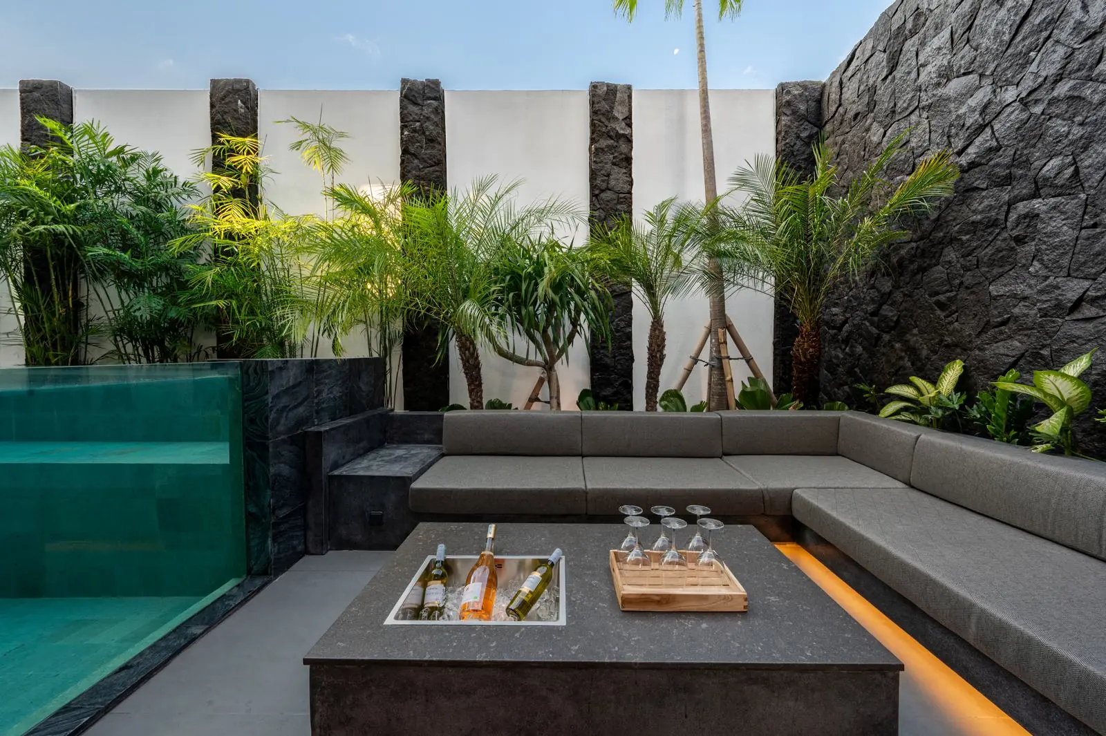 Sunken lounge beside the glass pool wall MAR Bali 1 luxury villa Pererenan Bali