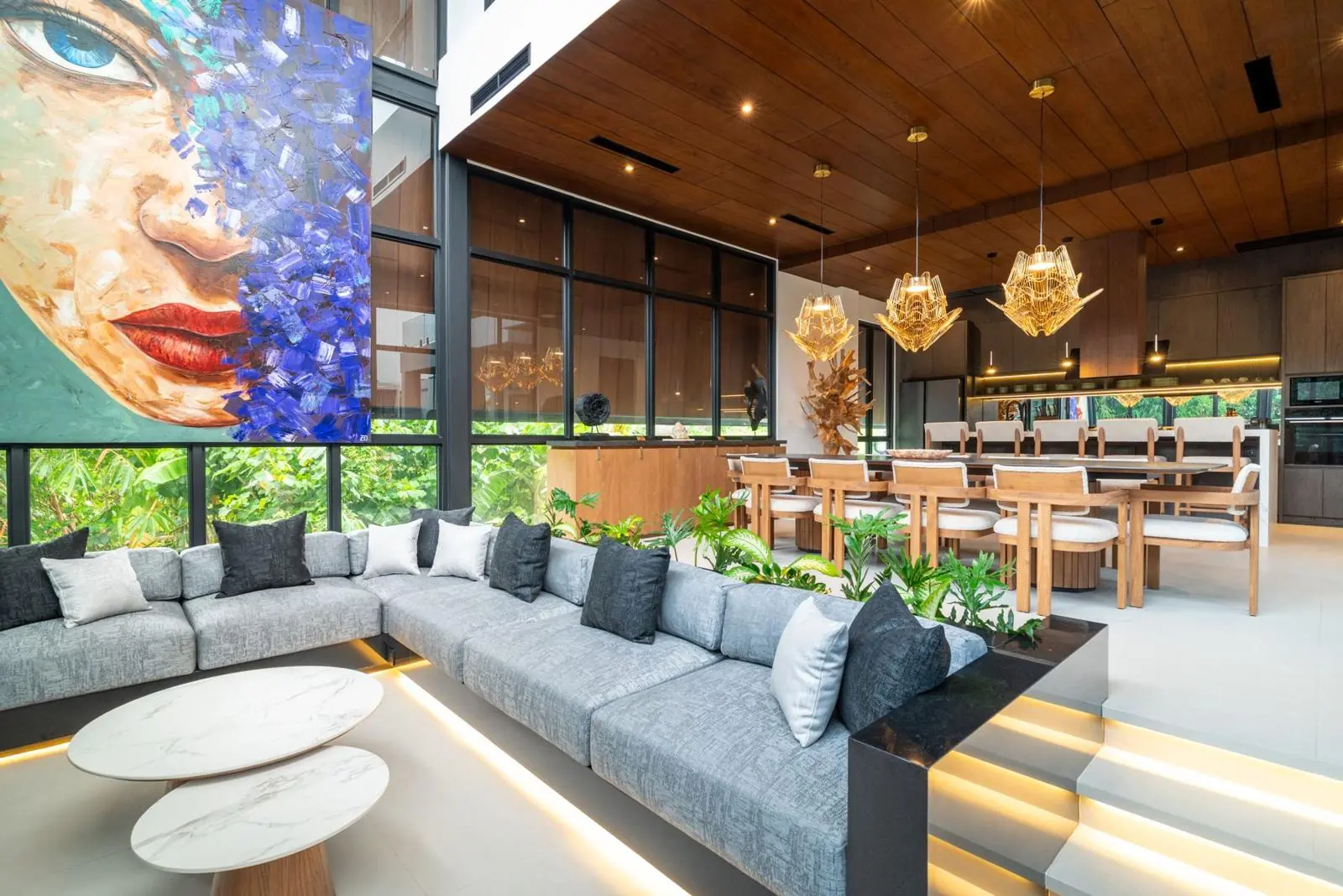 Double-height living room with original art and golden pendants MAR Bali 2 Pererenan Bali